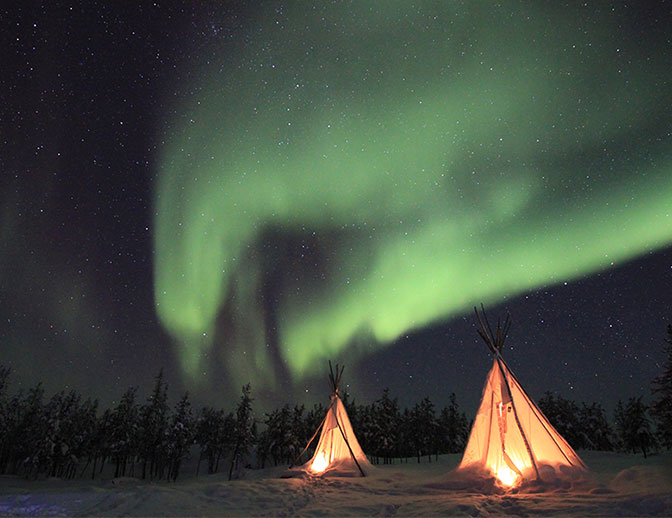 Camping under the stars, in snow at night