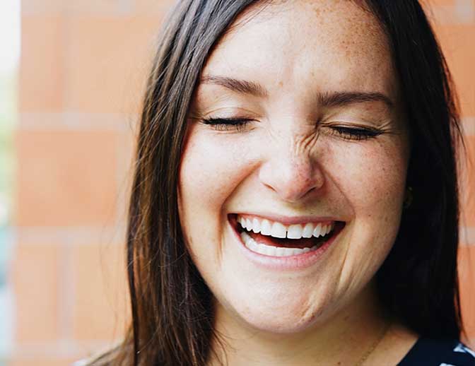 A happy CSM volunteer, smiling to the camera.